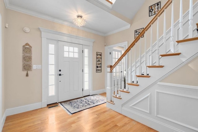 50 Sterling Rd, Needham, MA 02492 - entrance foyer featuring wood finished floors, stairway, crown molding, and baseboards