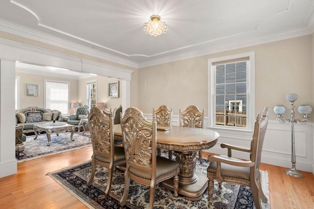 50 Sterling Rd, Needham, MA 02492 - dining area featuring light wood-style flooring, ornamental molding, and a chandelier