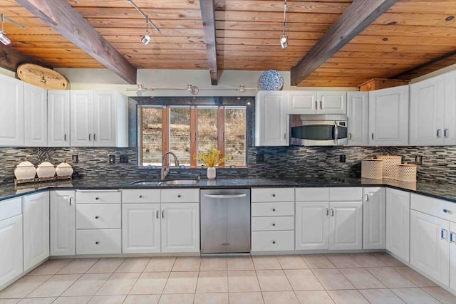 kitchen with a sink, stainless steel appliances, light tile patterned flooring, decorative backsplash, and wood ceiling