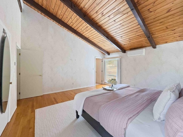 bedroom featuring beam ceiling, wooden ceiling, a wall mounted AC, and wood finished floors