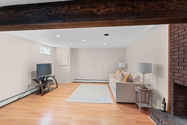 living area with baseboard heating, recessed lighting, a brick fireplace, and wood finished floors