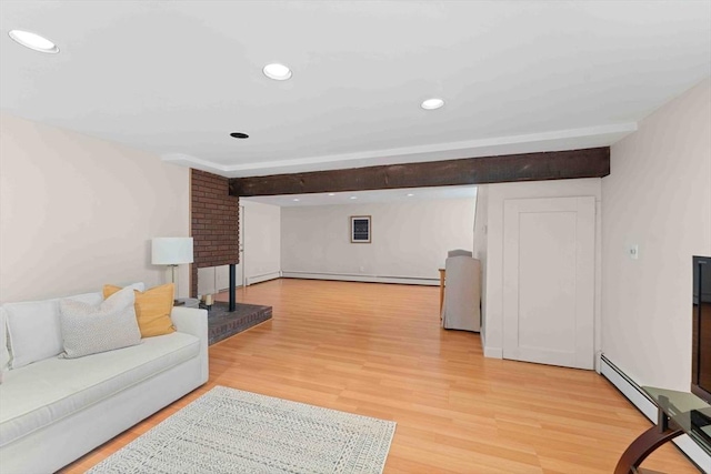 living room featuring light wood finished floors, baseboard heating, recessed lighting, and a baseboard radiator