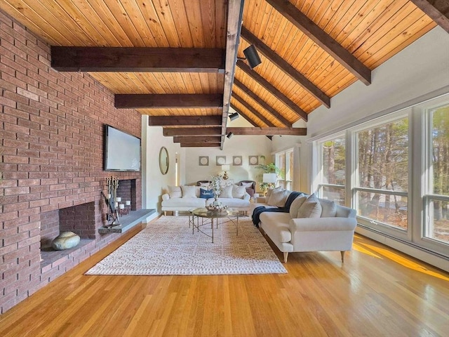 unfurnished living room featuring a brick fireplace, wood ceiling, and wood finished floors