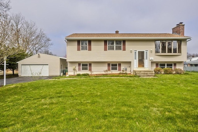 raised ranch featuring a chimney and a front yard
