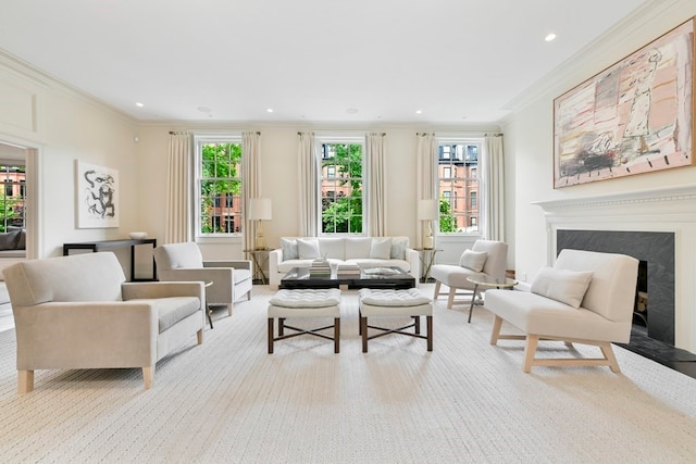 carpeted living room with ornamental molding, a high end fireplace, and plenty of natural light