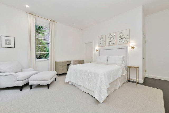 bedroom with hardwood / wood-style flooring