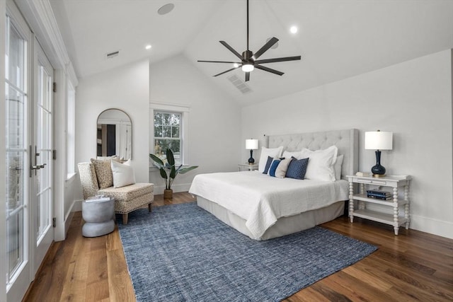 bedroom with visible vents, a ceiling fan, lofted ceiling, and wood finished floors