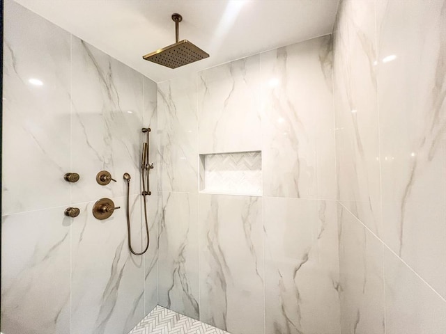 full bath featuring a marble finish shower