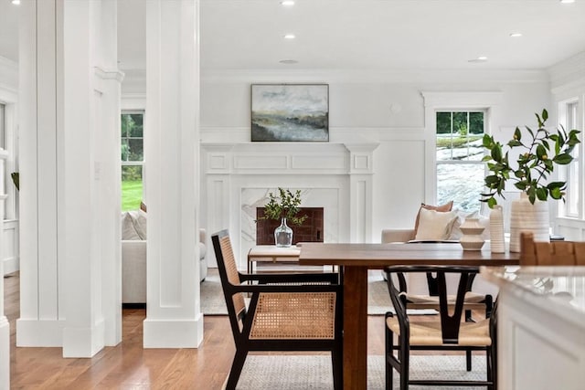 dining area featuring recessed lighting, light wood-type flooring, and ornamental molding