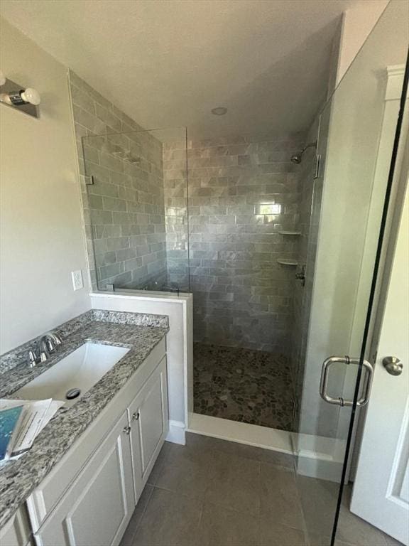 77 Lake Shore Dr, Weymouth, MA 02189 - full bathroom with a stall shower, vanity, and tile patterned flooring