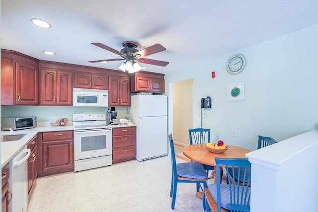 kitchen featuring ceiling fan and white appliances