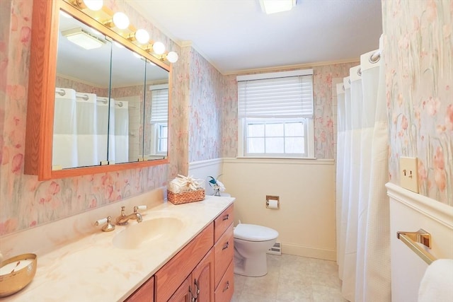 bathroom with plenty of natural light, toilet, walk in shower, and vanity