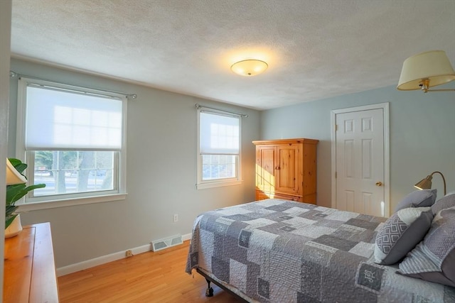 bedroom featuring light hardwood / wood-style floors