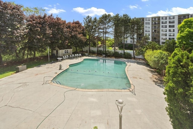 community pool featuring a patio area