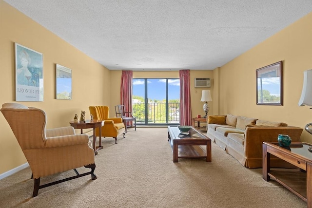 carpeted living area featuring a textured ceiling and an AC wall unit