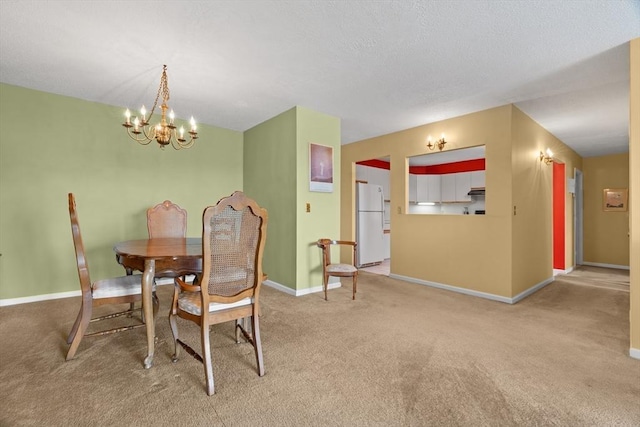 dining area featuring carpet, a chandelier, and baseboards