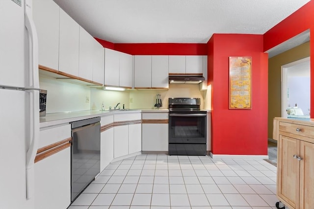 kitchen featuring black electric range oven, freestanding refrigerator, stainless steel dishwasher, under cabinet range hood, and light countertops