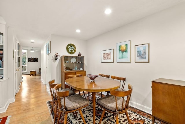 dining space with baseboards, ceiling fan, light wood-style flooring, and recessed lighting