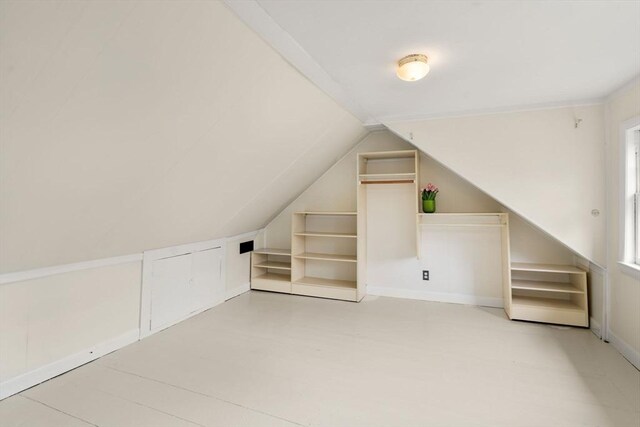additional living space with lofted ceiling
