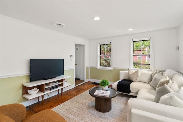 living area with wood finished floors, recessed lighting, and baseboards