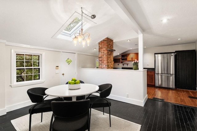 dining space with a skylight, dark wood finished floors, and baseboards