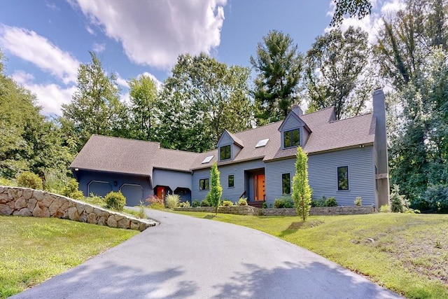 32 Garvey Rd, Framingham, MA 01701 - cape cod home featuring a front yard, driveway, a garage, and a chimney