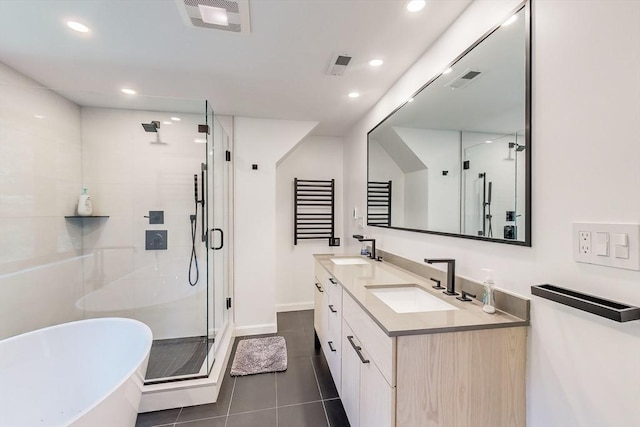 32 Garvey Rd, Framingham, MA 01701 - bathroom with a stall shower, a freestanding bath, double vanity, tile patterned floors, and recessed lighting