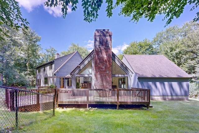 32 Garvey Rd, Framingham, MA 01701 - back of property with a deck, a yard, a chimney, and a shingled roof