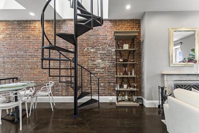 265 Beacon St Unit 5, Boston, MA 02116 - dining room with stairs, hardwood / wood-style flooring, baseboards, brick wall, and a fireplace