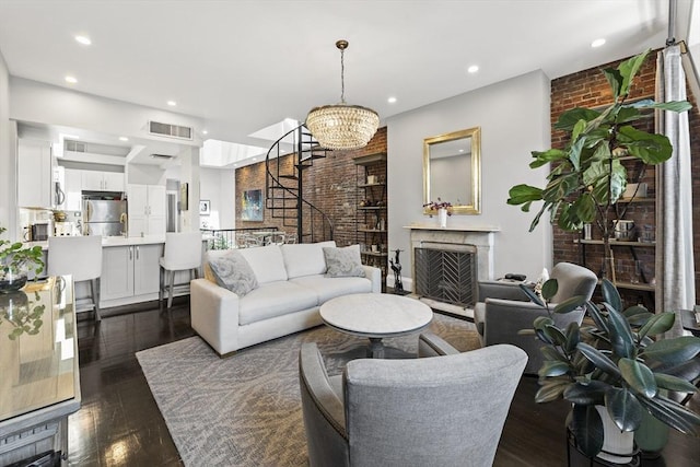 265 Beacon St Unit 5, Boston, MA 02116 - living area featuring brick wall, dark wood-type flooring, a chandelier, recessed lighting, and a fireplace