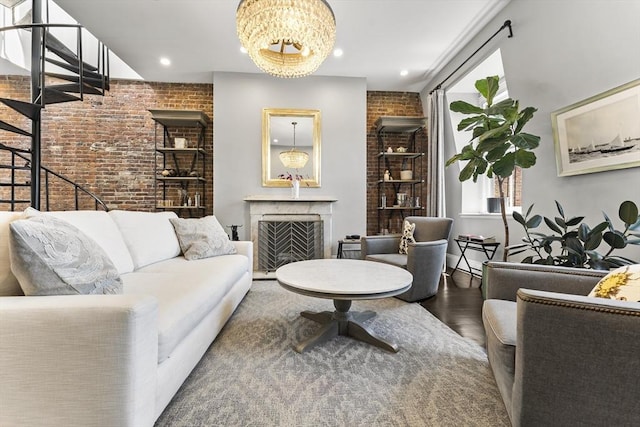 265 Beacon St Unit 5, Boston, MA 02116 - living area featuring brick wall, wood finished floors, a fireplace, recessed lighting, and a chandelier