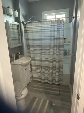 bathroom featuring vanity and walk in shower