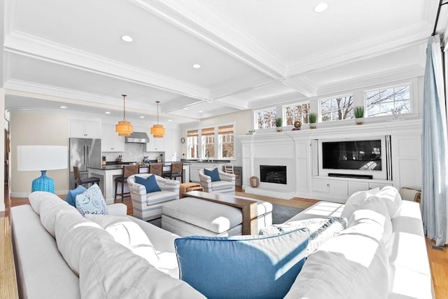 living room featuring coffered ceiling, recessed lighting, a fireplace, ornamental molding, and beamed ceiling