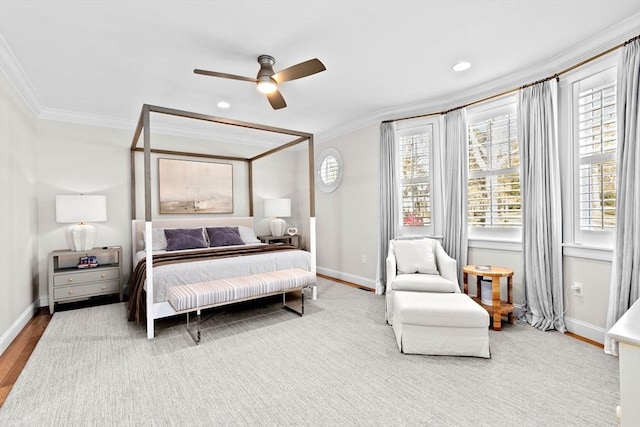 bedroom featuring ceiling fan, crown molding, baseboards, and wood finished floors