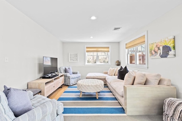 living room featuring visible vents, recessed lighting, and light wood-style floors