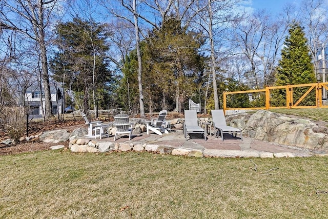 view of yard featuring an outdoor fire pit and a patio area