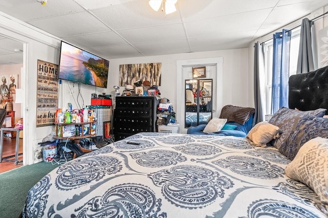 bedroom featuring a paneled ceiling