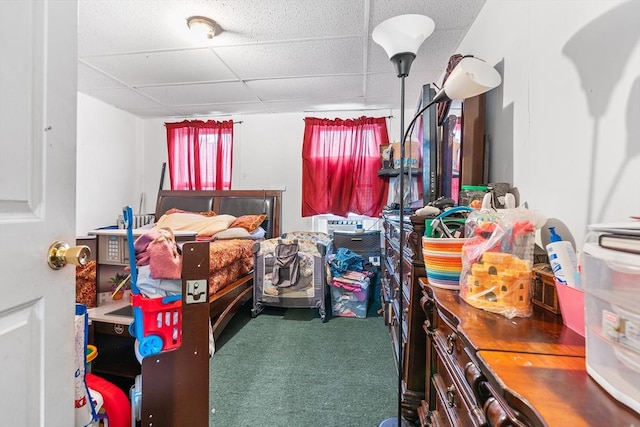 carpeted bedroom with a drop ceiling