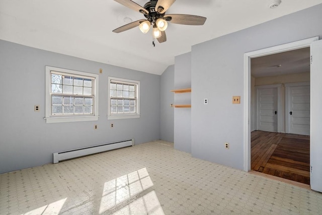 spare room with baseboard heating, a ceiling fan, carpet, and lofted ceiling