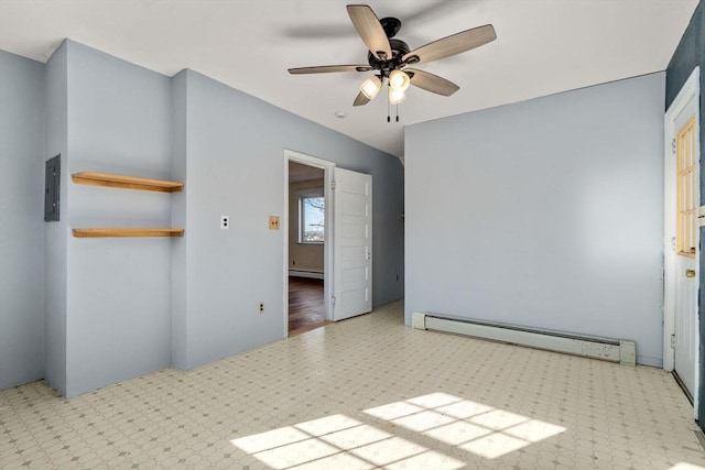 unfurnished room with a baseboard heating unit and a ceiling fan