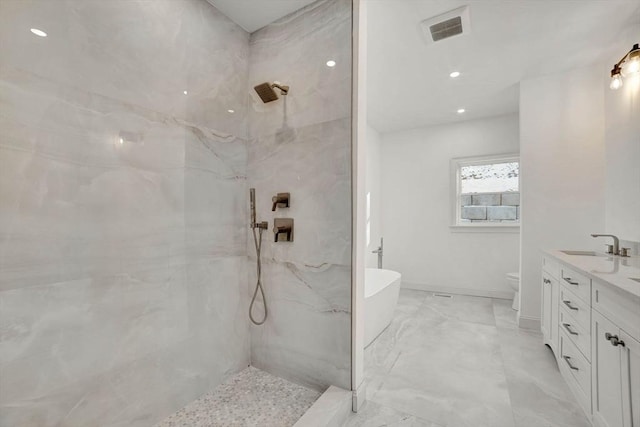 full bathroom with toilet, vanity, and shower with separate bathtub