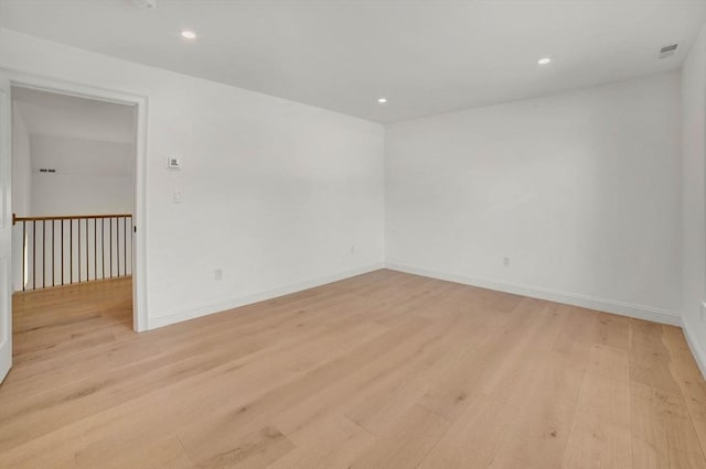 unfurnished room featuring light hardwood / wood-style flooring