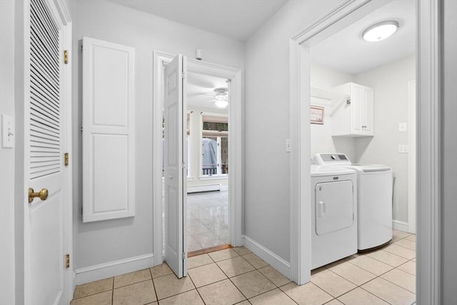 231 Manns Dr, Hanover, MA 02339 - laundry area featuring light tile patterned floors, separate washer and dryer, cabinet space, and baseboards