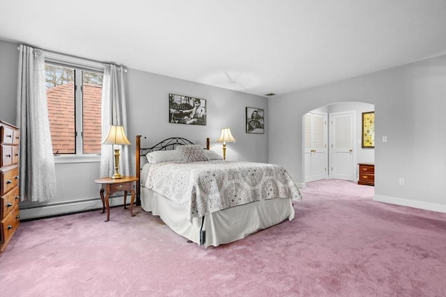 231 Manns Dr, Hanover, MA 02339 - bedroom featuring a baseboard heating unit, arched walkways, carpet flooring, and baseboards