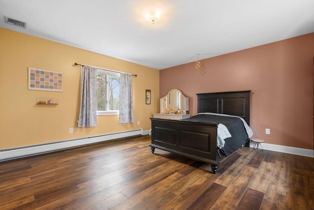 231 Manns Dr, Hanover, MA 02339 - bedroom with visible vents, dark wood-style floors, baseboard heating, and baseboards