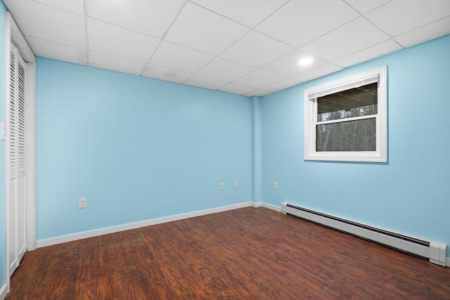 231 Manns Dr, Hanover, MA 02339 - interior space featuring a drop ceiling, wood finished floors, baseboard heating, and a closet