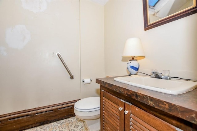 bathroom with toilet and vanity