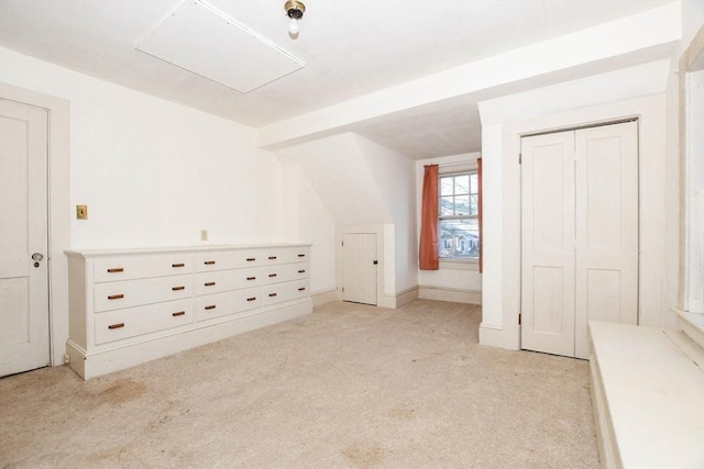 additional living space featuring light colored carpet