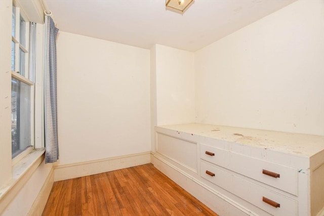 interior space with light wood-style floors and baseboards