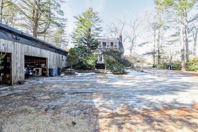 view of yard with a detached garage